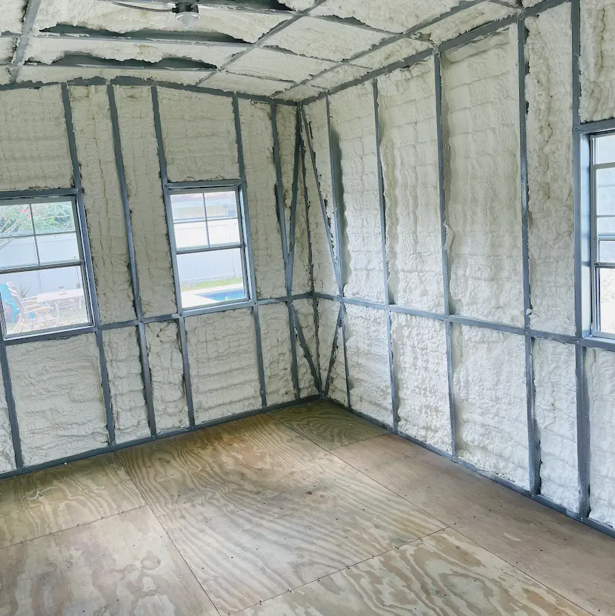 Closed-cell spray foam insulation applied to wall cavities in a residential project in Howell